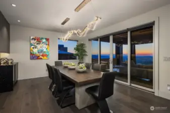 Dining area with elegant lighting, storage and access to covered, heated deck.