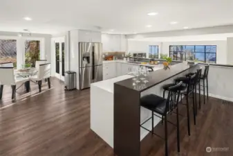 Kitchen with eating bar and dining room