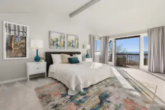 Gorgeous primary bedroom with cathedral ceilings and private deck with amazing views