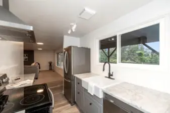 Lower Level Kitchen has an exceptional view of the very private backyard and multi use studio.