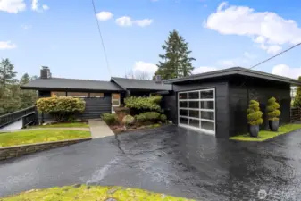 New 50 yr architectural comp roofing. Front Deck with composite decking, new treated plywood side ramp with anti-skid paint. Featuring Limelight Hydrangeas, Japanese maples, evergreen Topiaries and Crabapple trees.