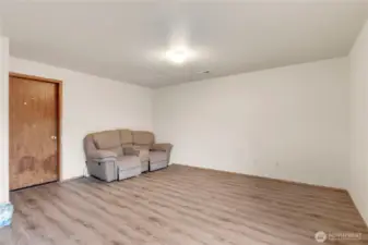 Large Family Room and door to the garage.