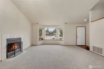 Living Room and Wood Burning Fireplace.