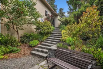 Stairs from backyard leading to carport
