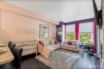 Kitchen opens to the spacious light filled living room with access to patio & gorgeous fireplace to enjoy on a cold night!