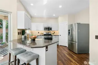 Open kitchen design with modern finishes and great flow.
