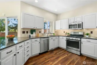 Granite countertops add style and durability. Stainless steel appliances including a new dishwasher (2024).
