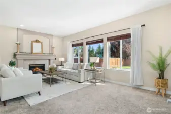 Family room with a cozy fireplace invites relaxation.