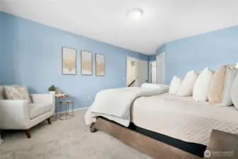 The primary suite boasts a private bath and walk-in closet.