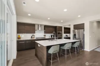 Kitchen with a peek at the grand butler's pantry in the distance