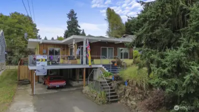 Expansive 2,700+ sq ft home with 4 beds, 2 baths, and a flexible lower level with private entrance—ideal for guest quarters, home office, or Airbnb/rental income