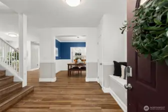 Your entry way, window seat bench with storage and a coat closet to the right.