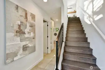 Walls of windows flood the spaces with natural light.    uilt-in bar and media console, plus wiring fo