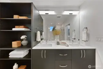 Primary bathroom has a double vanity, lots of storage and heated floors.
