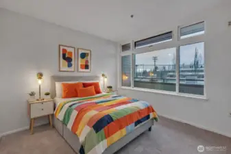 Virtually Staged Primary bedroom is light and bright, has ensuite bath and large closet.