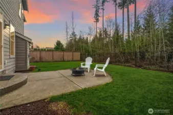 Serene yard backs to a small greenspace with access to nearby trails!