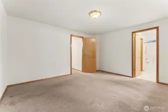 Here is another view of the spacious Primary Bedroom with the attached full bath and the walk in closet through the bathroom.  Easy living.