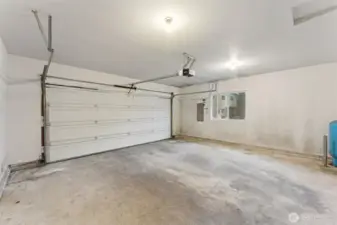 The two car garage pulls double duty here. Automatic opener for easy arrivals, plus a full side window that brings in natural light so you’re not working in a cave when the door is down. It’s a great setup for projects, storage, or tinkering weekends. Big bonus, the home has a brand new water heater and a new pressure tank for the well, the kind of updates you’re always happy the last owner already handled.