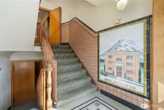 Just inside the main entrance - head down the stairs to get to the unit