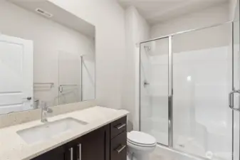 3/4 bath on main level adjacent to bedroom or home office.  Home for sale will include white cabinetry.