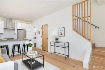 Cool woodwork and other finishes show the attention to detail this builder has. Living room + kitchen and eating area plus 1/2 bath and washer dryer in closet all on this efficient floor.
