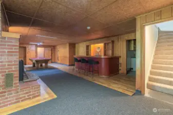 Welcome to the Daylight basement living area. Imagine a renovated custom bar, game room or resigned Mother-In-Law suite for potential rental income.