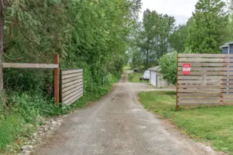Property is fully fenced, but the gate offers easy ingress/egress for larger vehicles, offering unique business potential.