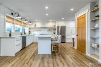 Beautiful kitchen with t quartz counters and tons of storage.