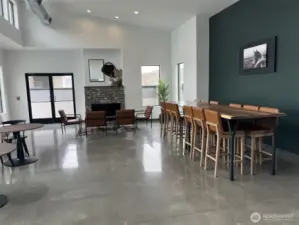 Inside the clubhouse, lots of compy sitting areas, inside bathroom, fireplace  and meeting room.