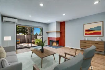 Spacious living room/dining area that has sliding door to patio area. This photo is Virtually Staged.
