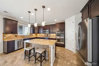 Kitchen with double ovens, undercounter lighting and walk in pantry
