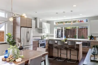 This immense kitchen offers ample Euro-style cabinetry with tons of storage and prep space!