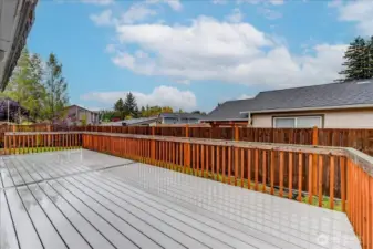 Composite deck is about 3/4 length of the back of the house and has a section with an awning, for shade in the summer.