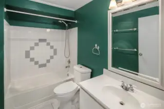 The full bathroom is accessed in the hallway near the kitchen, that way your guests aren't needing to pass through the primary. A proper tub is always nice!