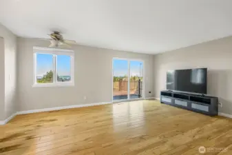 Spacious living room with deck access.