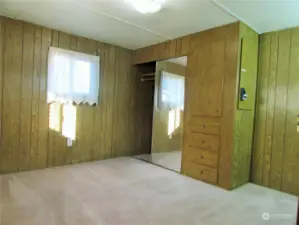 PRIMARY BEDROOM WITH BUILT IN STORAGE.