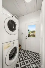 Laundry and mud room that leads to the private backyard.