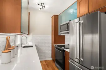 Updated stainless steel appliances, quarts countertops and newer cabinetry.