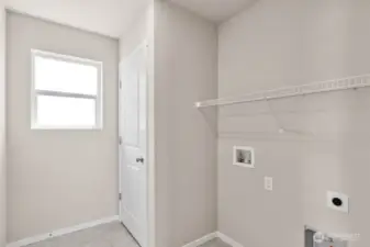 Photo is of a similar home. Colors and materials may vary.