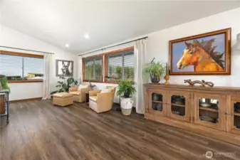 Open area off kitchen and dining room leading to living room