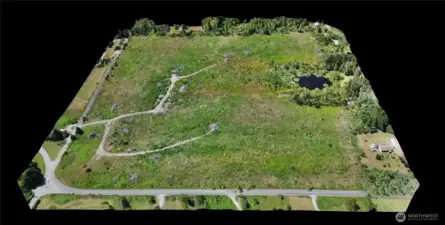 This view shows elevation looking west, this parcel is at the lower left and is level.