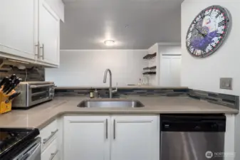 Looking from the kitchen back toward the dining/living space.