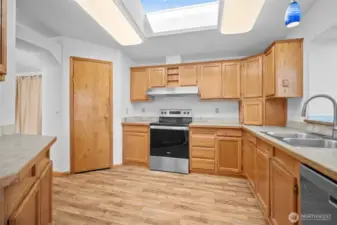 Well-equipped kitchen with ample counter space, a pantry, storage closet, and appliances included.