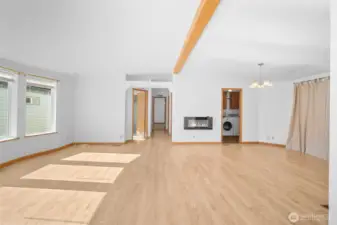 View from the living area toward bedroom 2 and hallway leading to the private primary suite - easy flow and comfortable layout.