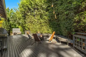 This deck is directly off the kitchen. View of hot tub in the side yard in the distance.