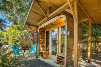 Relax year round in three + person sauna with separate roof structure to protect it from NW winters.
