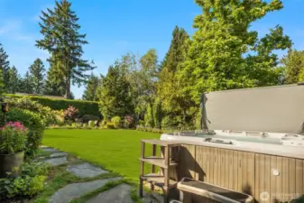 This side yard is amazing with assorted edible plants, fruit trees and nice level play / entertaining space. The hot tub has been well maintained and is fully functioning.