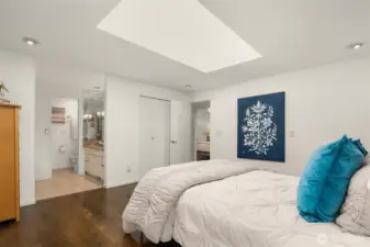 Additional view of primary bedroom featuring double closets and 3/4 bath with steam shower.