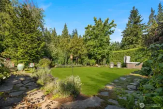 Side yard - North side with pathways and beautiful plantings.