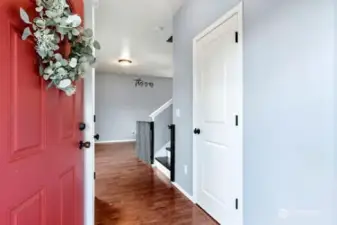 Main entry door to your new home.  To the left is a large closet, to the right, is the downstairs laundry room.  Behind the closed door on the right is the main bath and stairway to upper level.
